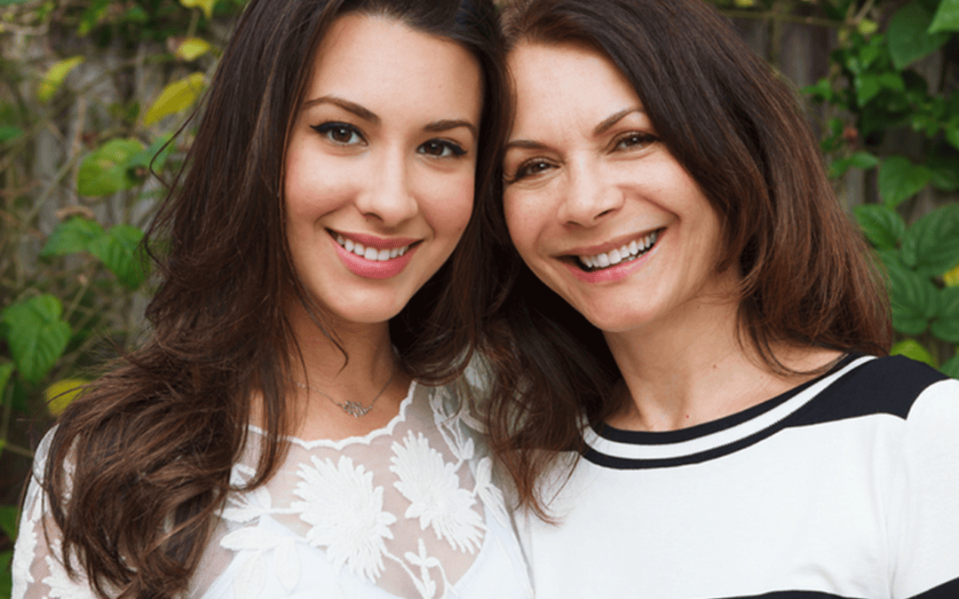 Mother and daughter with a beautiful smile